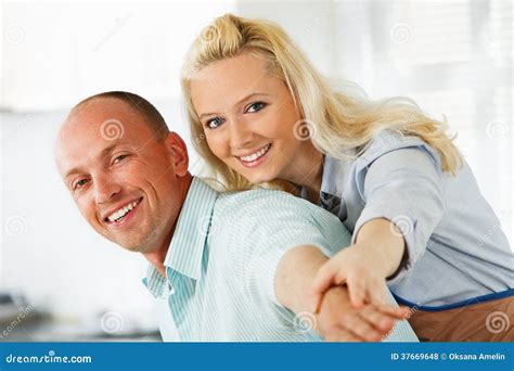 Embraced Couple Enjoying in Their Kitchen Stock Photo - Image of ...