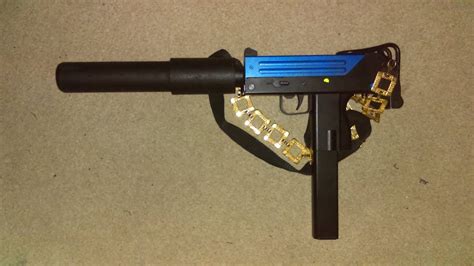 Airsoft review of the electric Mac 10 by JG in two-tone blue with a large suppressor - YouTube