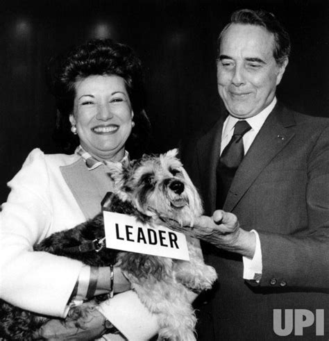 Photo: Elizabeth Dole presents her husband Robert Dole with a new dog. - WAP1128111984 - UPI.com