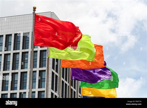 Various single-colour flags flying from a row of flag poles in Shanghai, China Stock Photo - Alamy