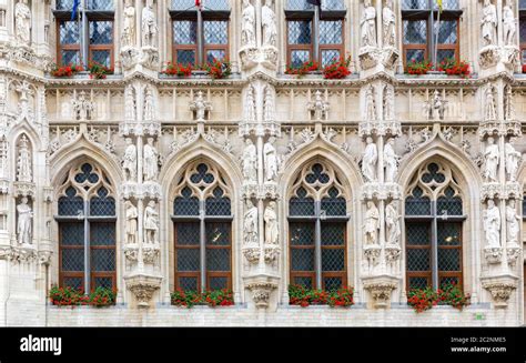 Ancient stone building facade with big windows, old Europe. European ...