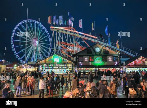 Crowds at food stalls and funfair rides, Winter Wonderland, Hyde Park, London, UK Stock Photo ...