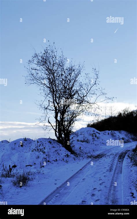 mountain road with snow Stock Photo - Alamy