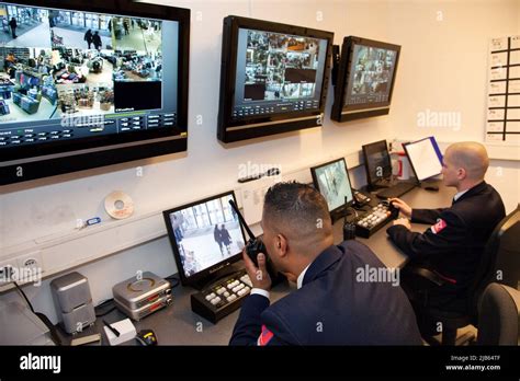 Netherlands. Security guards in a big shopping mall are watching the ...