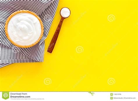 Food Helps Digestion. Greek Yogurt in Brown Bowl Near Spoon on Blue Tablecloth, Yellow ...