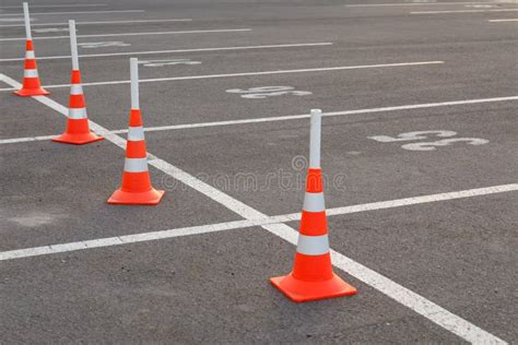 Marked Parking Spaces with Orange Traffic Cones Stock Photo - Image of plastic, road: 180184332