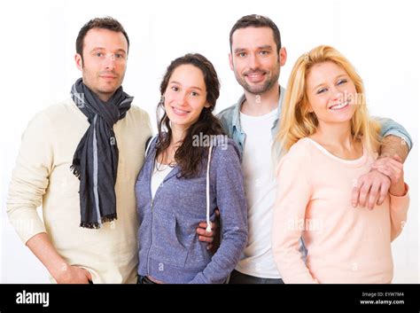 View of a Group of 4 young attractive people on a white background ...