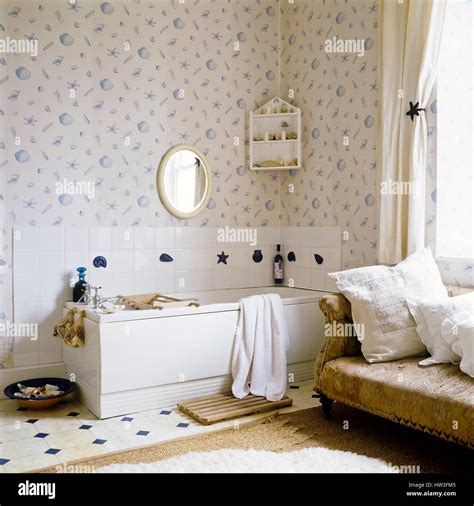 Bathroom with seashell patterned wallpaper Stock Photo - Alamy