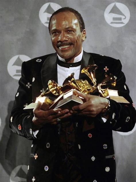 Quincy Jones and some of the many Grammy Awards that he has won during his long and stellar ...