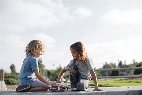 "Two Little Kids Playing Cars Together Outside At Park" by Stocksy ...