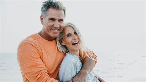 happy senior couple spending time at the beach. Concepts about love ...