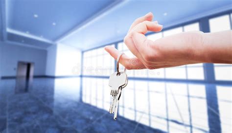 Woman`s Hand Holding The Keys To An Apartment. Stock Image - Image of hold, broker: 116794959