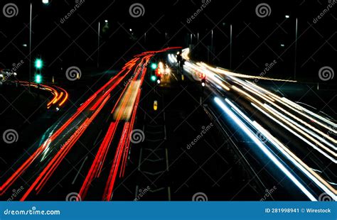 Aerial Night-time View of a Busy Highway, with Cars Driving in Both ...