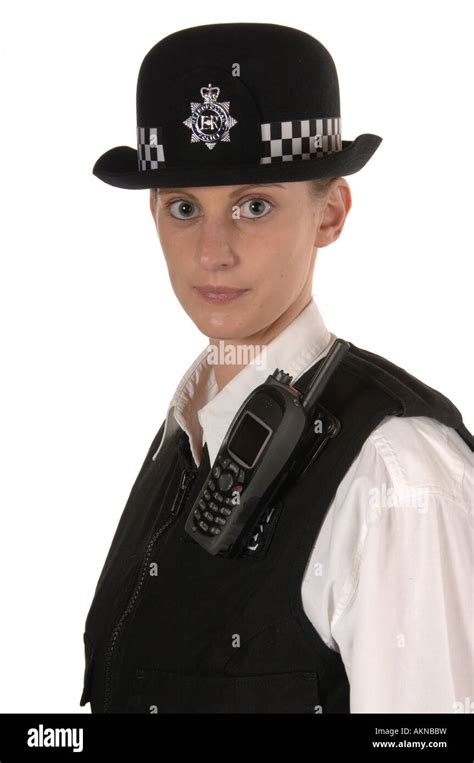 Uniformed UK female police officer looking to the front isolated on ...