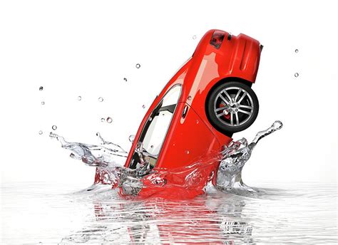 Red Car Splashing Into Water Photograph by Leonello Calvetti