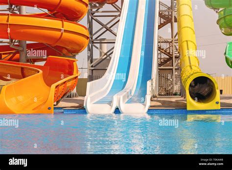 Multicoloured big water slide in the public swimming pool Stock Photo - Alamy