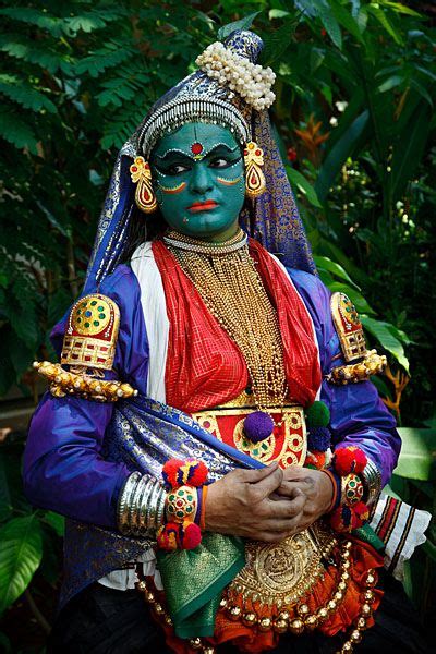 Portrait of Kathakali dancer in full make-up and costume portraying a ...