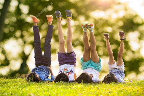 Children laying on grass Stock Photo by ©pat138241 42498345