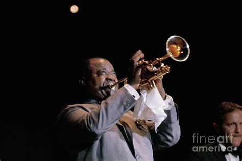 Louis Armstrong Playing Trumpet by Bettmann