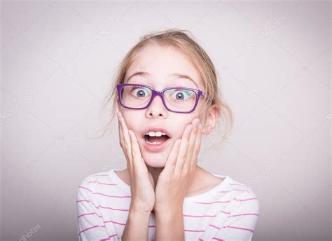 Surprised or shocked face of child girl in violet glasses Stock Photo ...