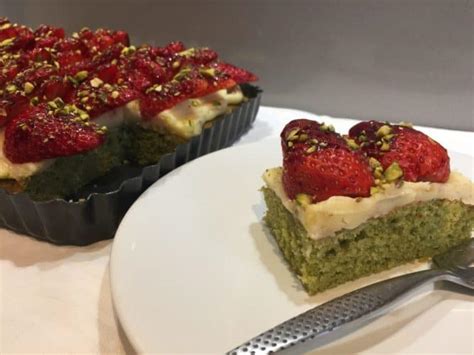 Matcha Green Tea cake with a white chocolate frosting, topped with strawberries and Pistachio ...