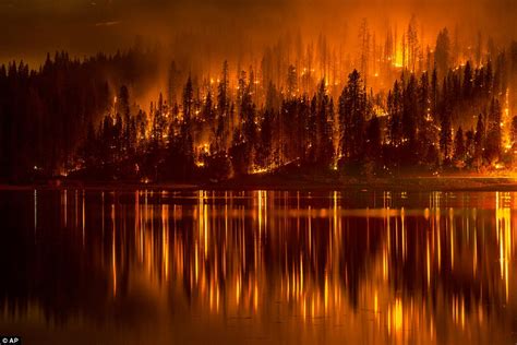 Hundreds forced to flee their homes as two wildfires tear across 800 ...