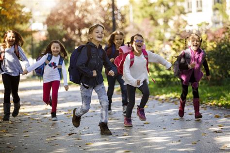 School kids running in schoolyard | Center for International ...