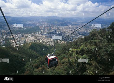 Venezuela - Caracas. The cable car in the Parque Nacional El Avila. In the background the city ...
