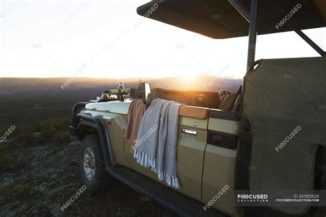 Sunrise behind safari off-road vehicle South Africa — Eco Tourism ...