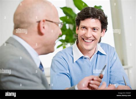 Germany, Munich, Business people talking, portrait Stock Photo - Alamy