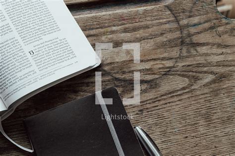 Open bible with pen and notebook — Photo — Lightstock