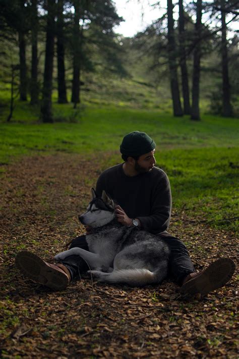 A Man Sitting with His Dog · Free Stock Photo