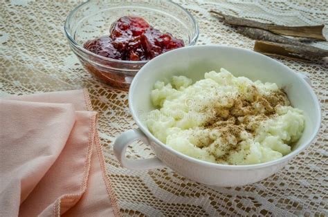 A Dish of Rice Pudding with Jam and Cinnamon. Stock Image - Image of ...