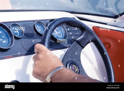 Steering a boat Stock Photo - Alamy