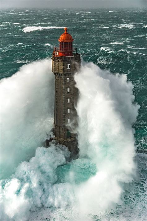 La Jument Lighthouse gets pounded by heavy seas : r/pics