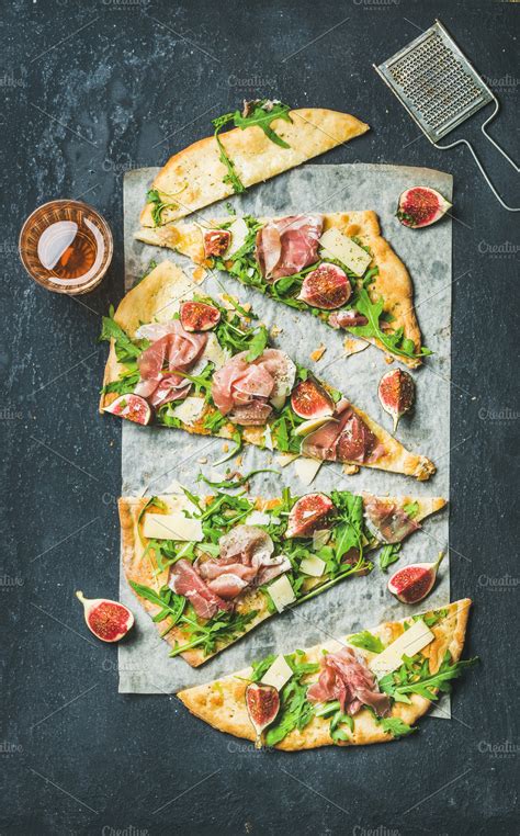 Flatbread pizza cut into pieces ~ Food & Drink Photos ~ Creative Market