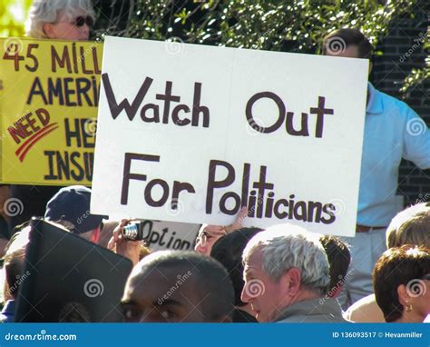 Political Rally with Protest Sign Stating `Watch Out for Politicians ...