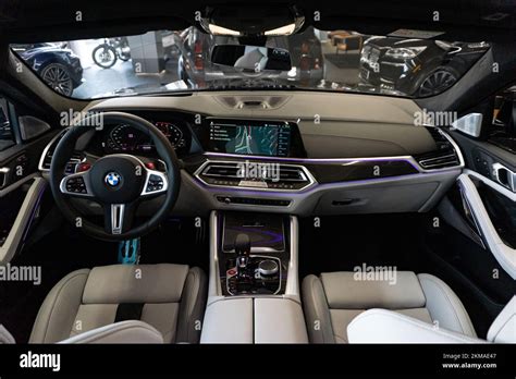 The cockpit of the BMW X6 M Competition car with a white leather ...