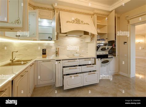 Luxury beige and gold classic kitchen interior Stock Photo - Alamy