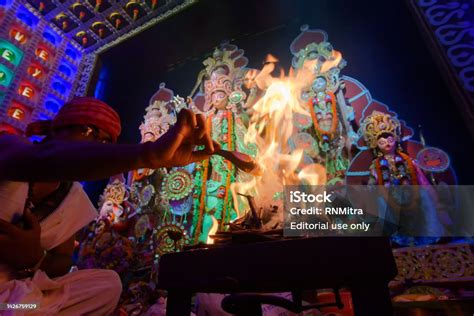 Hindu Purohit Raising Holy Fire Of Yajna To Worship Goddess Durga In ...