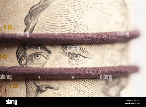 Portrait of Alexander Hamilton in Roll of Ten Dollar Bills Stock Photo - Alamy