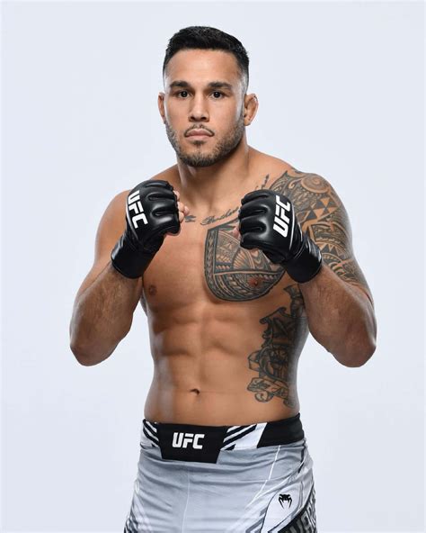 Download Ufc Fighter Brad Tavares With White Backdrop Wallpaper | Wallpapers.com