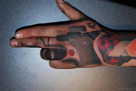 28 Funky Gun Tattoos On Hand