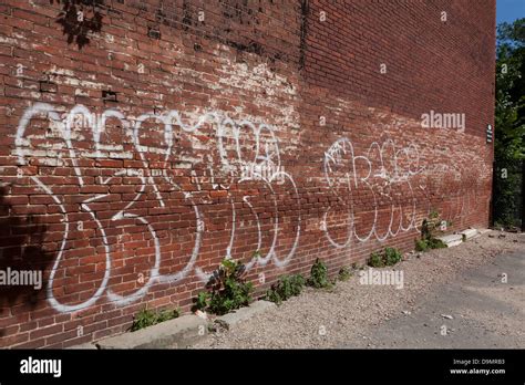 Graffiti on side of brick building - USA Stock Photo - Alamy