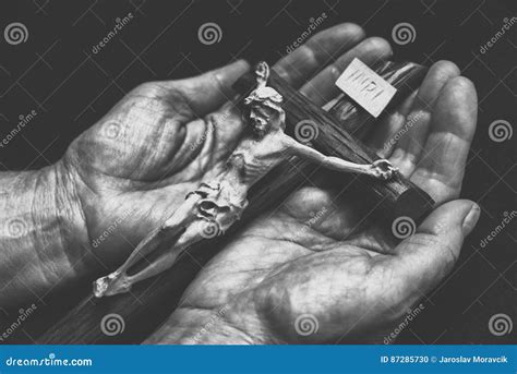 Jesus on cross in hands stock photo. Image of male, hands - 87285730