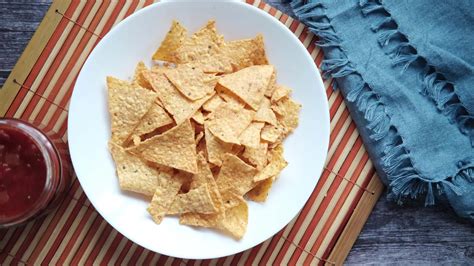 A bowl of chips and salsa on table 24494193 Stock Video at Vecteezy