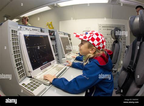 A young visitor at the interior of the AWACS plane at the airport in ...