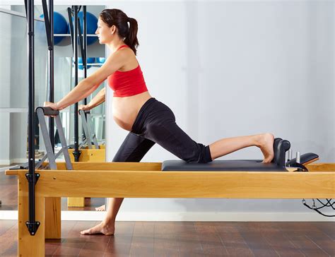 pregnant woman pilates reformer cadillac exercise | Lake Health Group