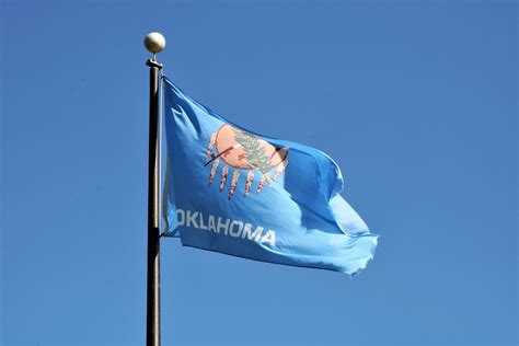 Oklahoma State Flag On Blue Sky Free Stock Photo - Public Domain Pictures
