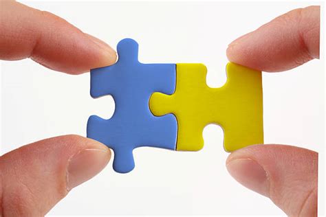 Puzzle Pieces Coming Together Pictures, Images and Stock Photos - iStock